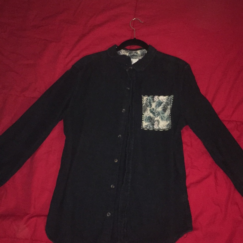 On the Byas navy jean button up shirt.